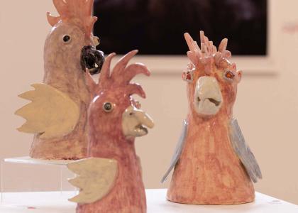 pink ceramic bird sculptures