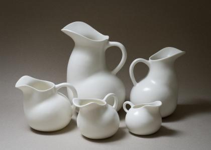 photo of a cluster of white ceramic water jugs